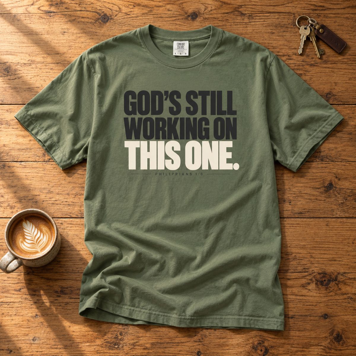 God’s Still Working Tee