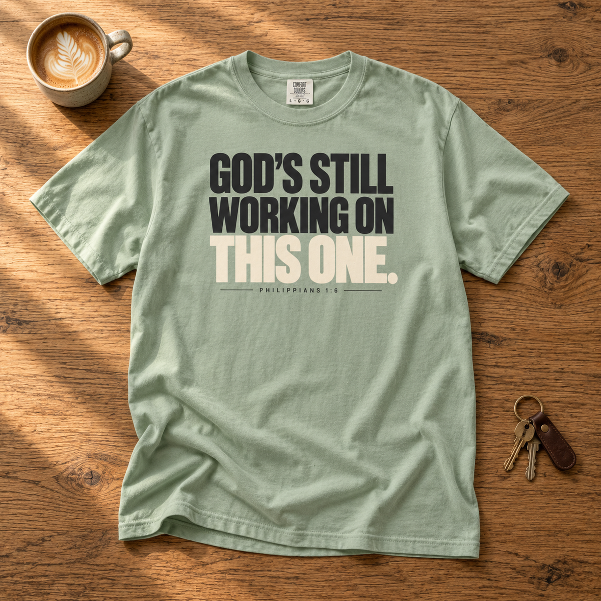 God’s Still Working Tee