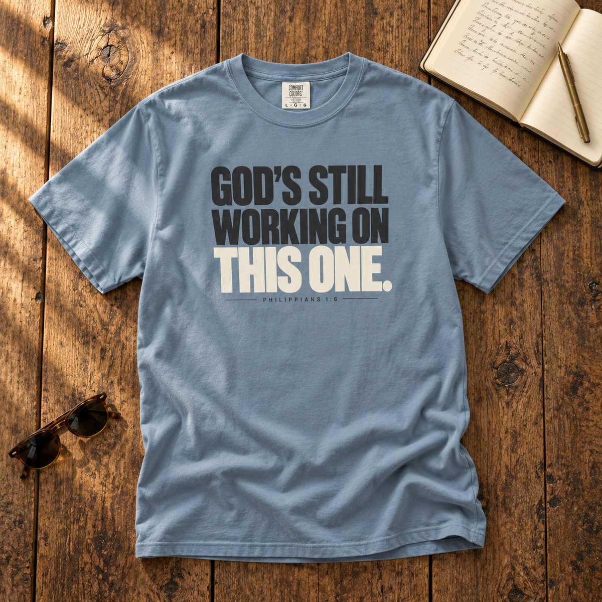 God’s Still Working Tee