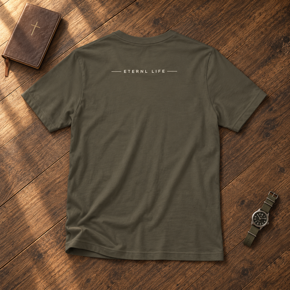 CHOSEN. army tee back with ETERNL LIFE wordmark on rustic wood