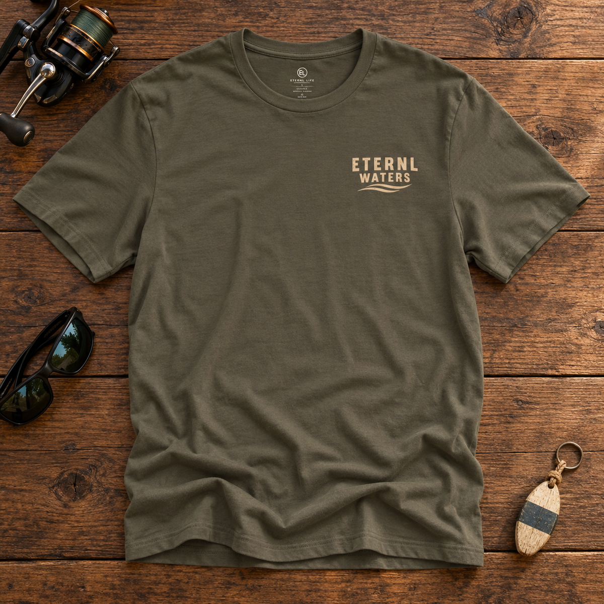 Do Not Disturb Army tee front with ETERNL WATERS chest logo on rustic wood